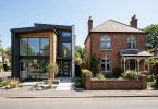 New construction vs existing homes — a new build home beside an older existing home